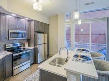 Large kitchen sink with gooseneck faucet